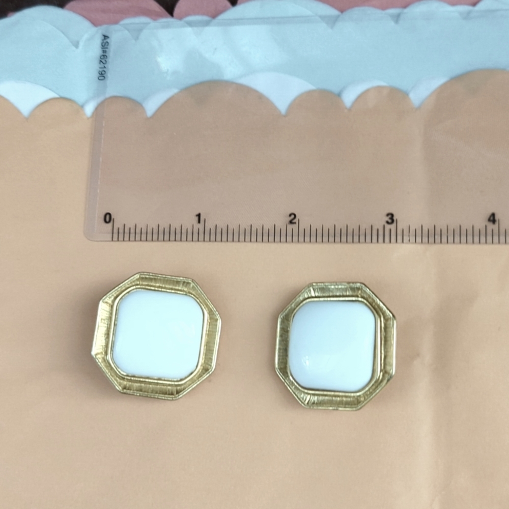 Gold tone + white clip on earrings